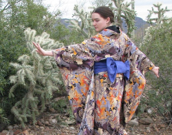 A furisode that I made with a dragon-pattern cotton print. Authentic furisode are not cotton, however here in Arizona, so far from Japan, the best designs readily available are found on cottons in quilting supply stores. Also, traditionally, dragons appear only on mens' kimono, and furisode (kimono with very long sleeves) are only worn by young single women. Basically, there are so many rules that adhering to them all takes all the fun out of this fashion. Just wear what keeps you covered and makes you happy. XD